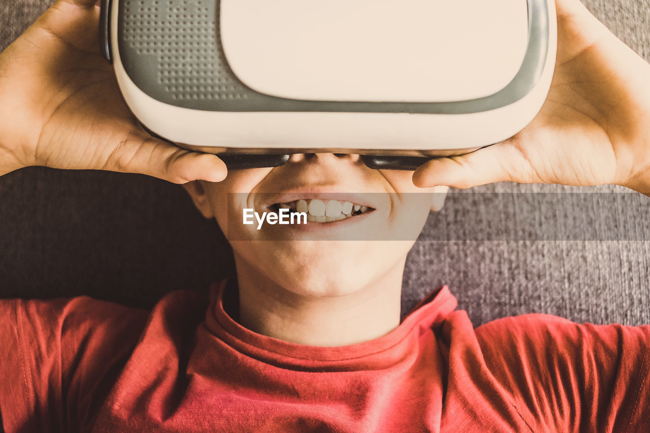 Close-up of boy wearing virtual reality sunglasses