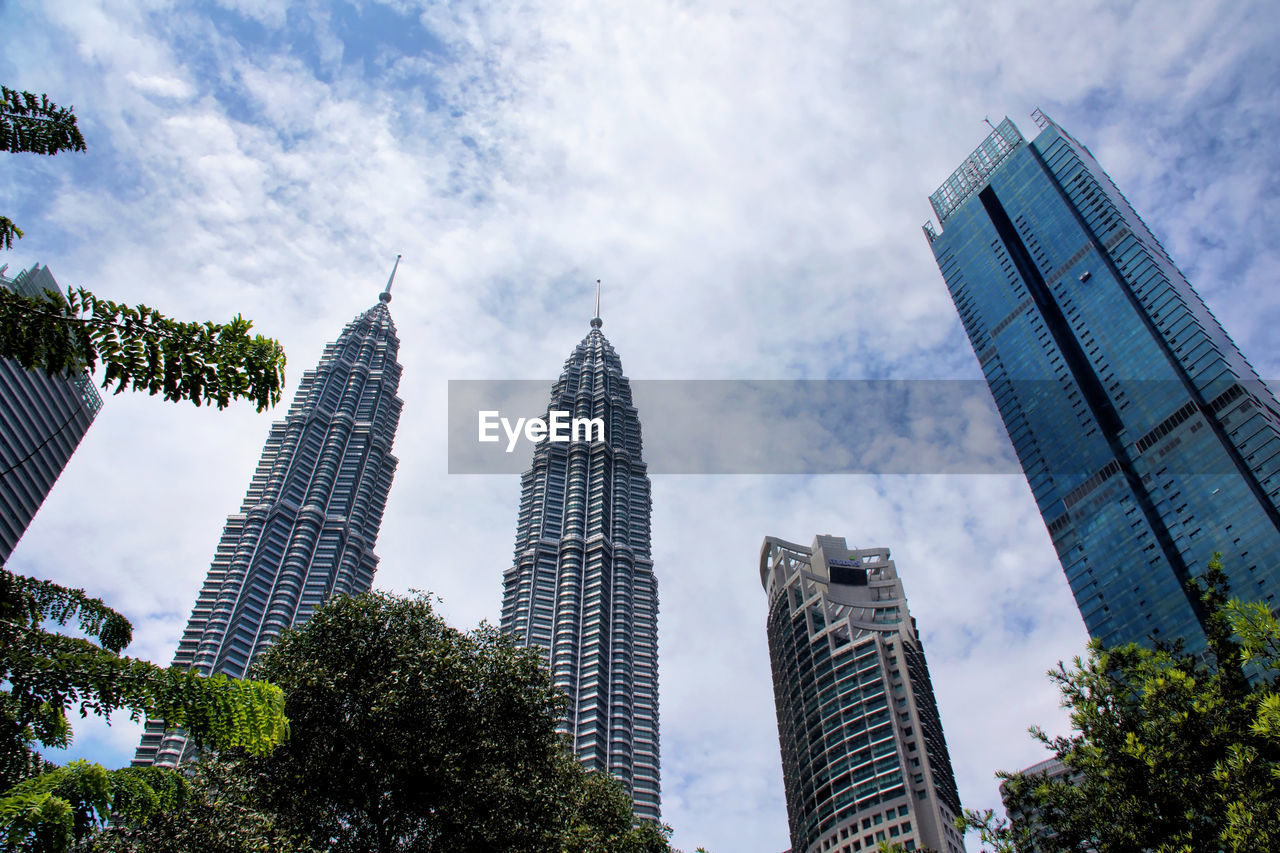 Low angle view of klcc park with petronas towers