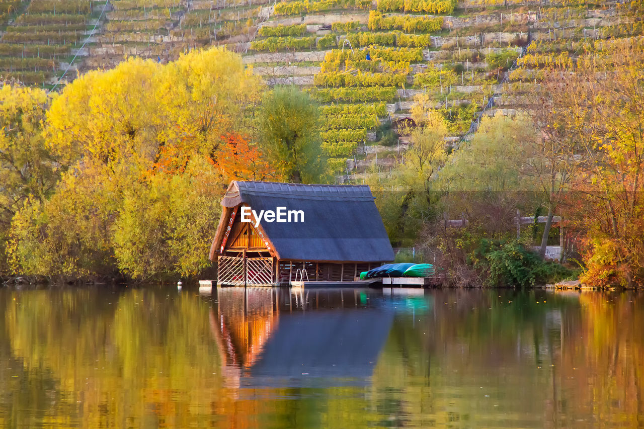 GAZEBO BY LAKE DURING AUTUMN