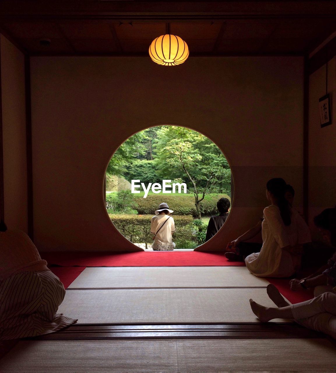 People sitting in japanese temple