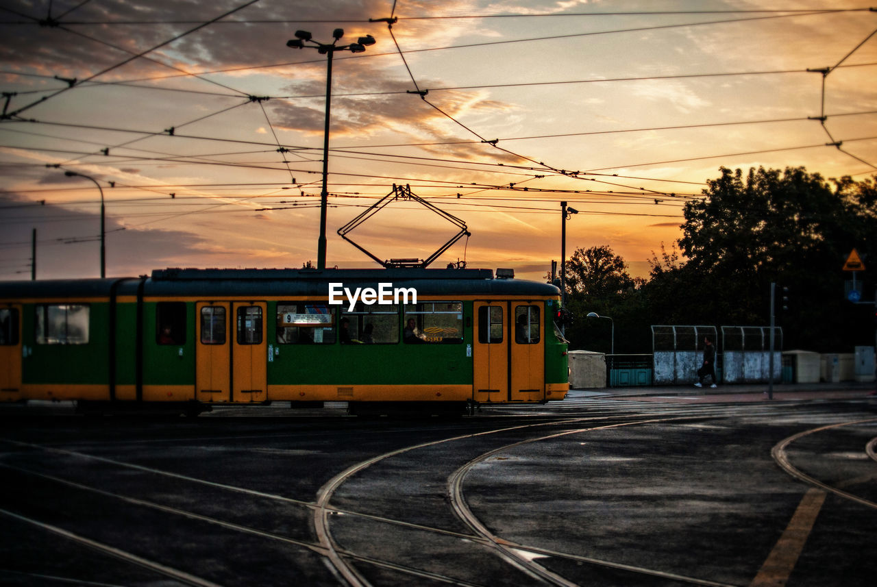Cable car on tracks at sunset