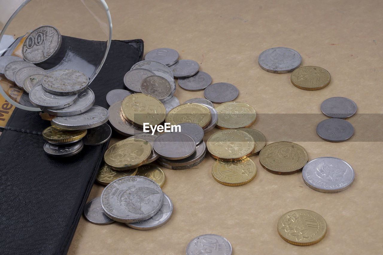 High angle view of coins on table