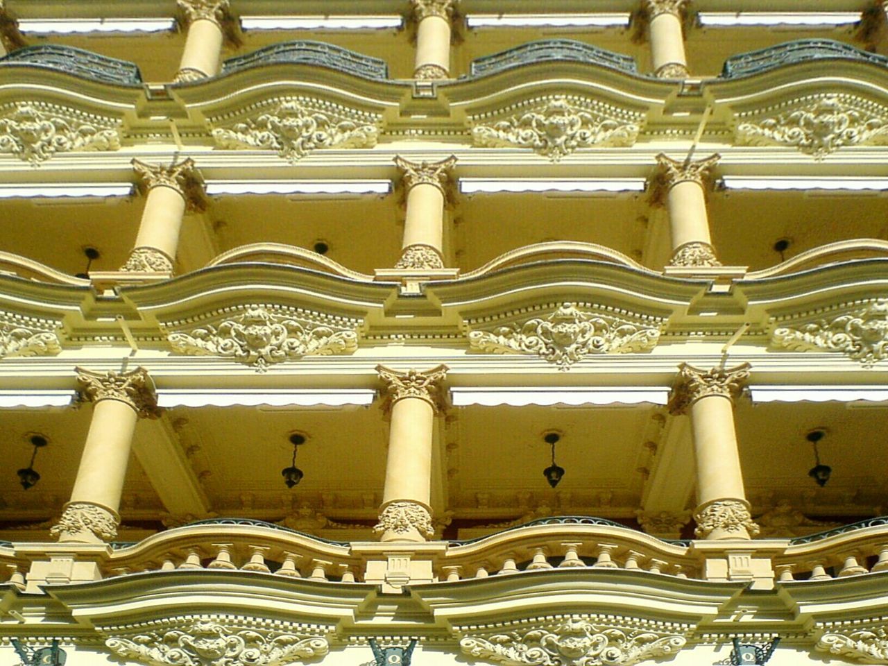 FULL FRAME SHOT OF CARVINGS ON WALL