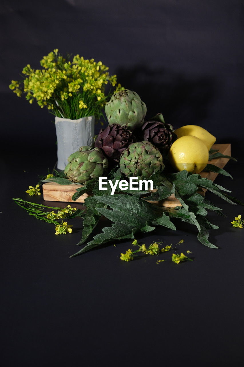 healthy eating, food and drink, food, green, yellow, freshness, wellbeing, vegetable, studio shot, black background, flower, floristry, macro photography, leaf, plant, fruit, indoors, nature, no people, floral design, produce, organic, branch, plant part, still life, close-up, raw food
