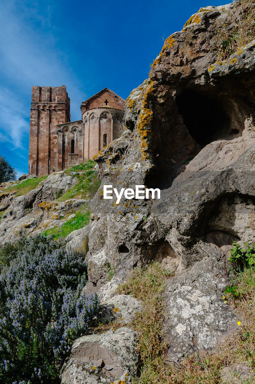 Low angle view of old ruin building against sky