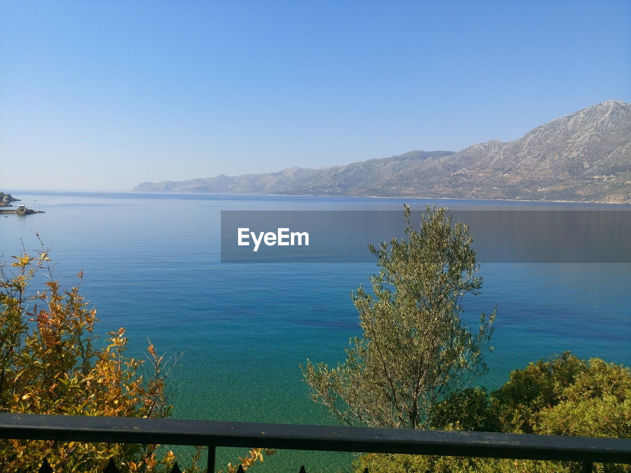 SCENIC VIEW OF LAKE AND MOUNTAINS