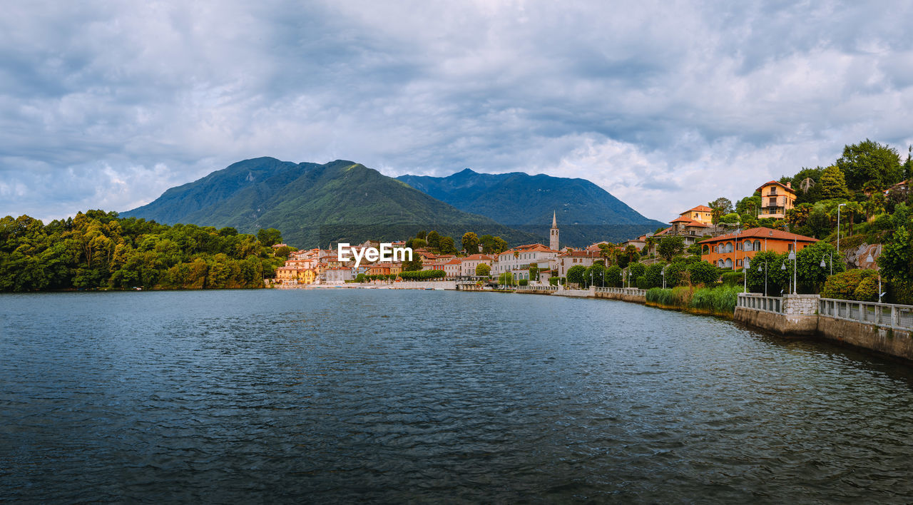 View of the village of mergozzo on the homonymous lake with cloudy sky