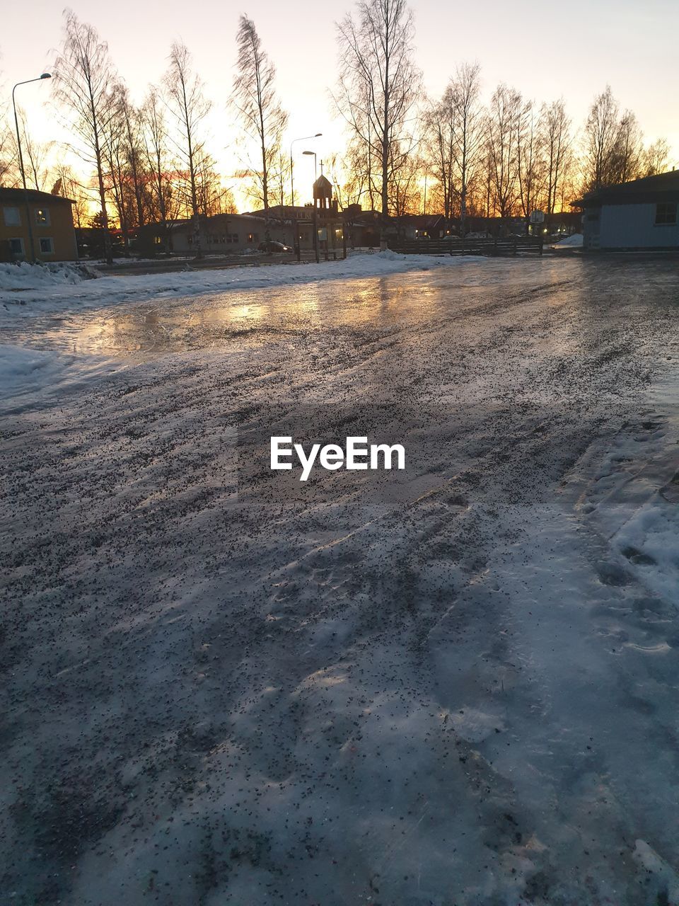 FROZEN LAKE AGAINST SKY DURING WINTER