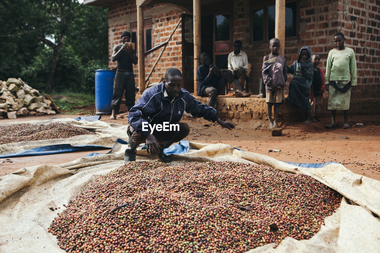 MAN WORKING AT MARKET