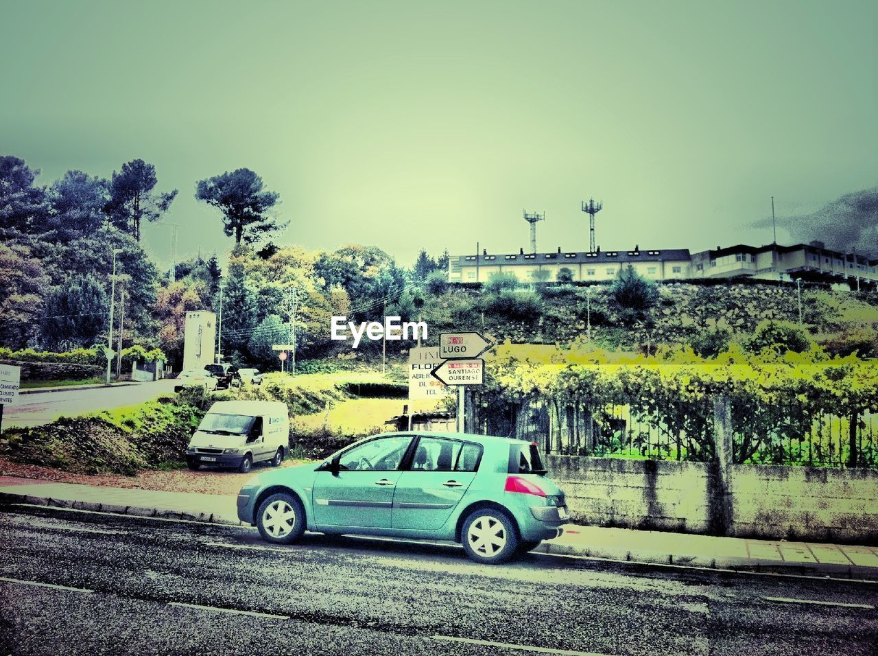 VIEW OF CAR ON ROAD AGAINST CLEAR SKY