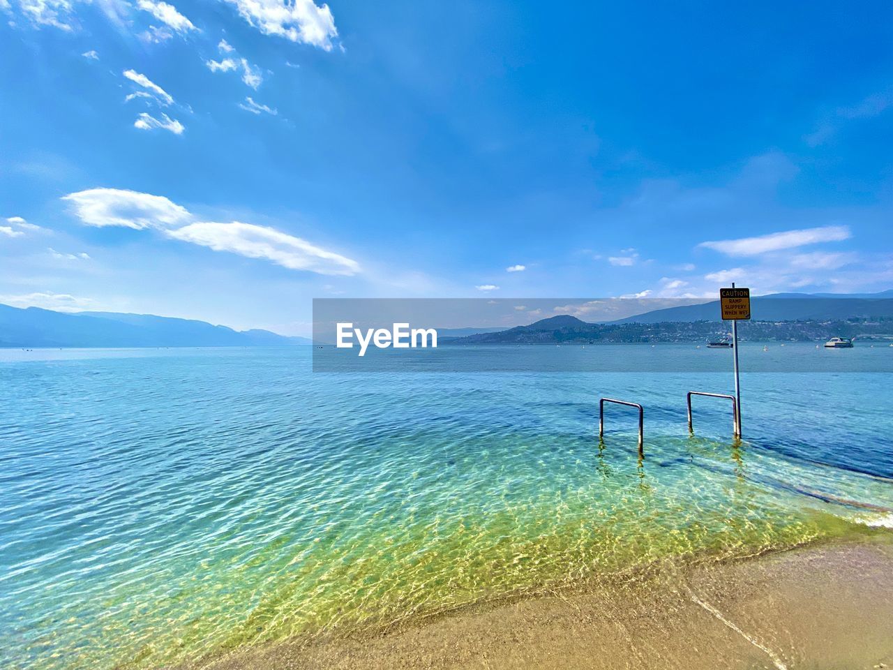 sky, water, ocean, horizon, sea, scenics - nature, shore, nature, coast, land, beauty in nature, beach, cloud, tranquility, blue, tranquil scene, body of water, bay, travel, wave, travel destinations, no people, day, landscape, environment, vacation, holiday, outdoors, trip, sand, idyllic, sunlight, tourism, summer, mountain, wind wave