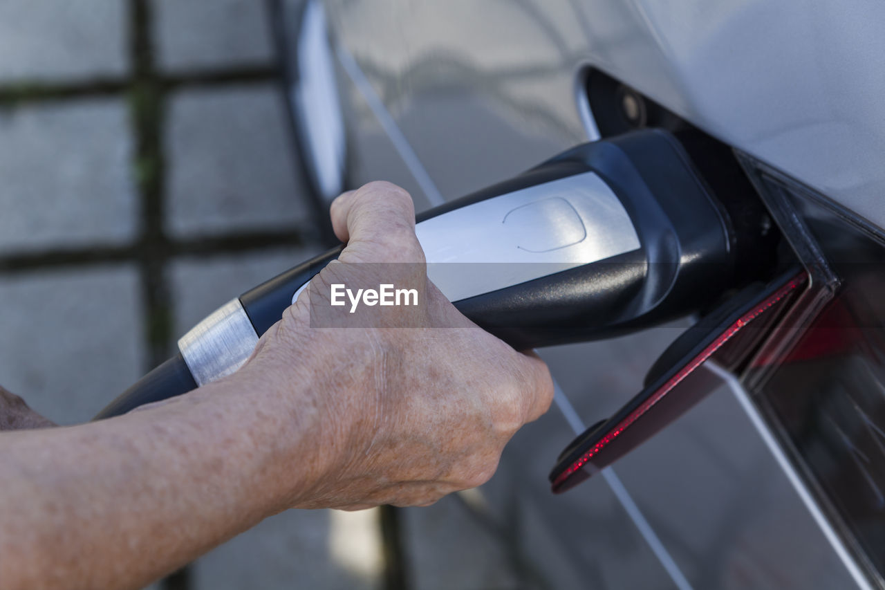 Charging of an electric car, close-up