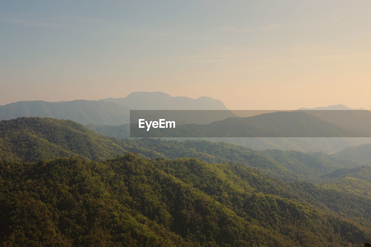 Scenic view of mountains against sky during sunset