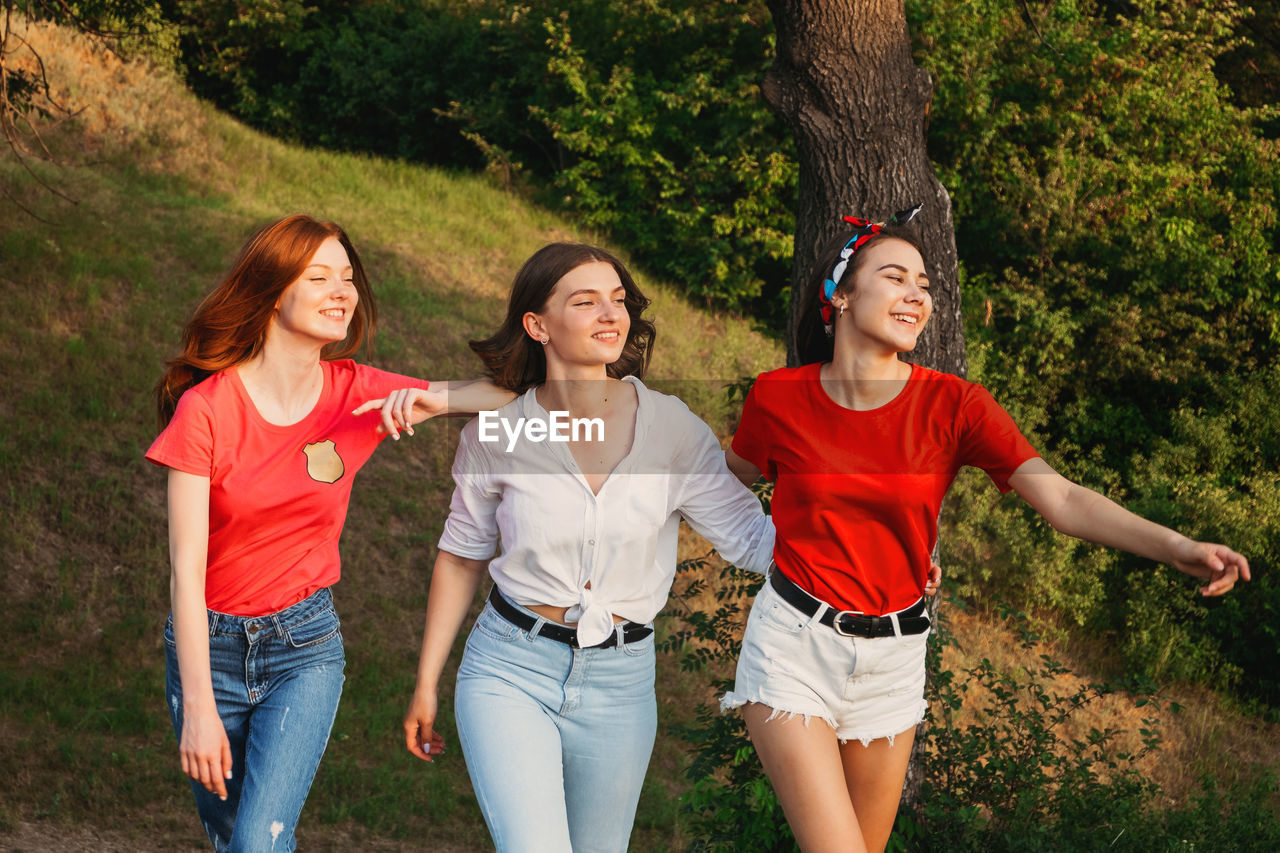 Gen z, friendship, togetherness. three happy girl friends, teenage girls enjoing their tim