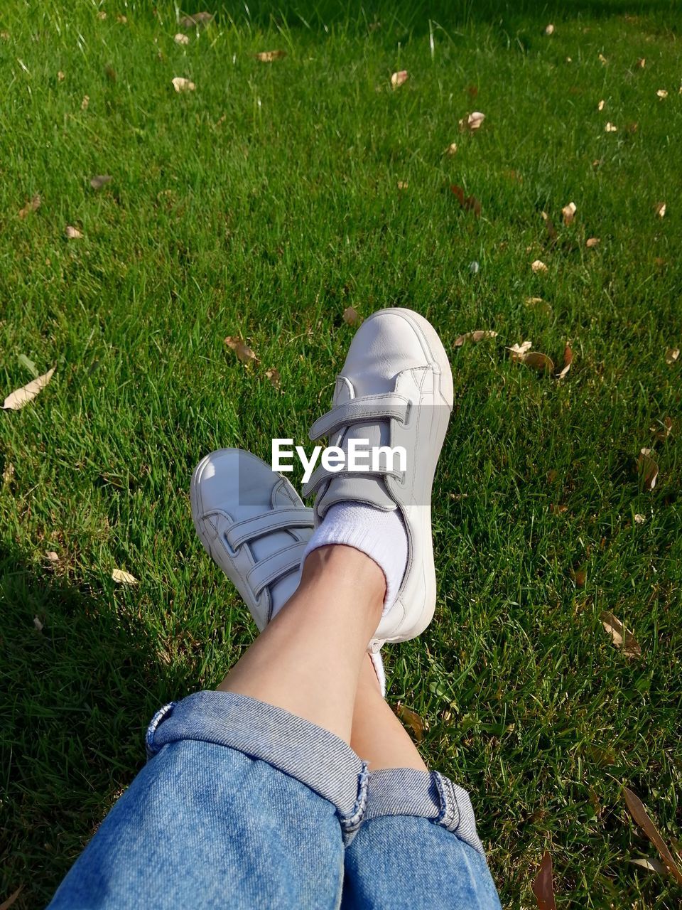 Close-up woman legs on the grass