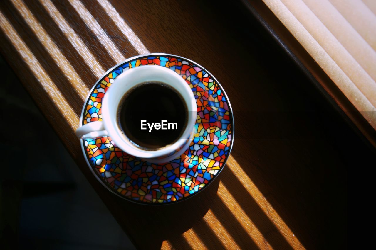 Close-up of fresh turkish coffee in pot on window sill