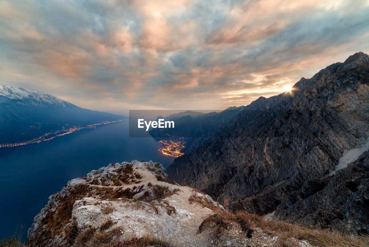 Scenic view of mountains against cloudy sky