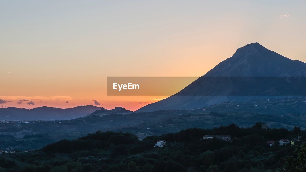 Scenic view of mountains against sky during sunset