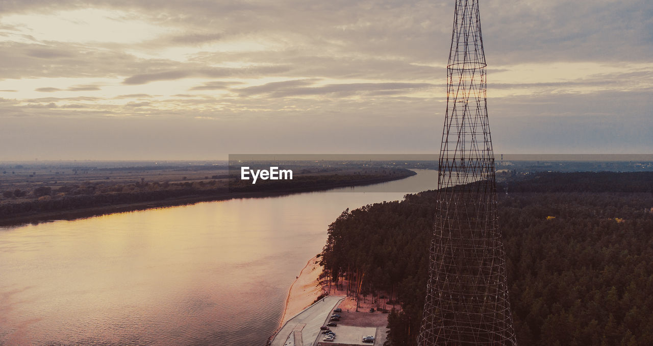 reflection, sky, water, tower, cloud, horizon, architecture, nature, evening, built structure, sea, dusk, sunset, beauty in nature, scenics - nature, travel destinations, no people, outdoors, technology, environment, land, tranquility, landscape, transportation, industry, tranquil scene, travel, sunlight, coast