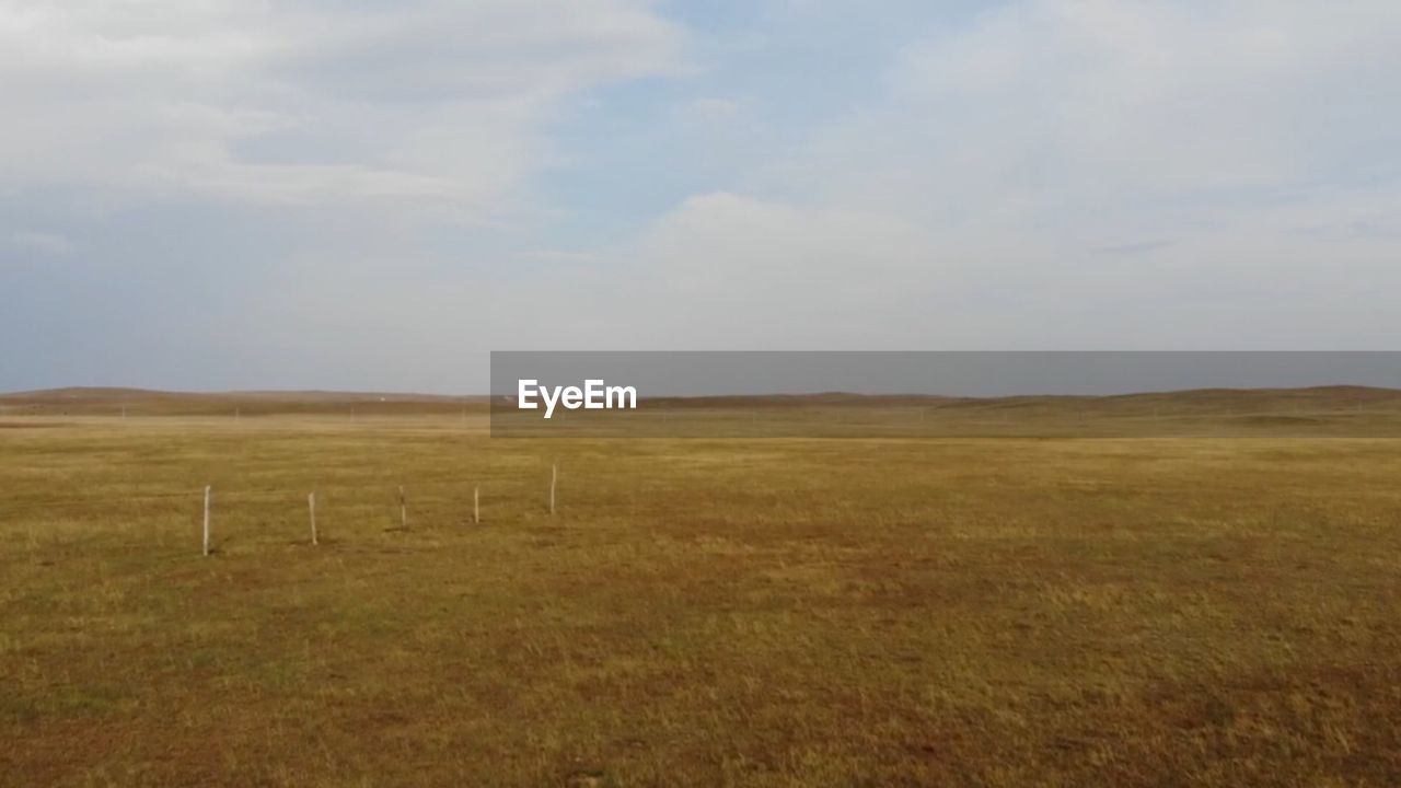 SCENIC VIEW OF FARM AGAINST SKY