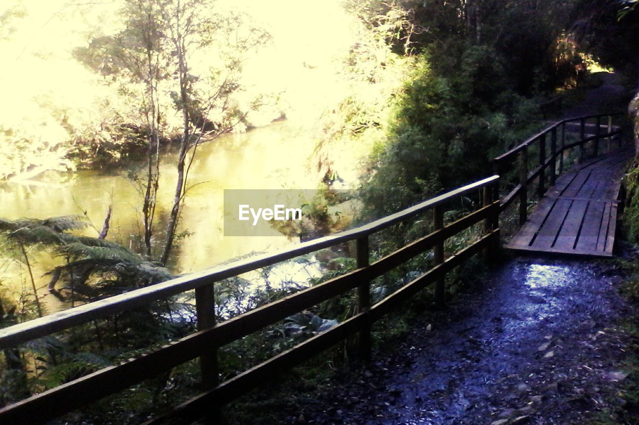 VIEW OF FOOTBRIDGE OVER RIVER