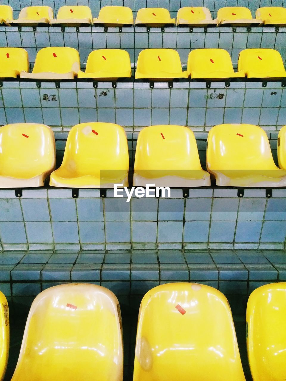 Empty yellow bleachers in stadium