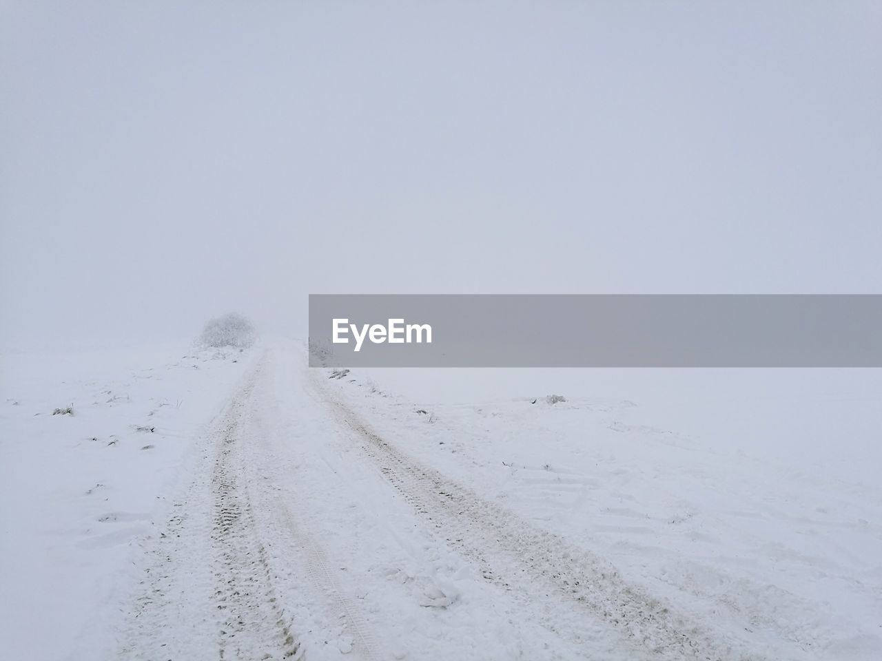 Scenic view of snow covered landscape against sky