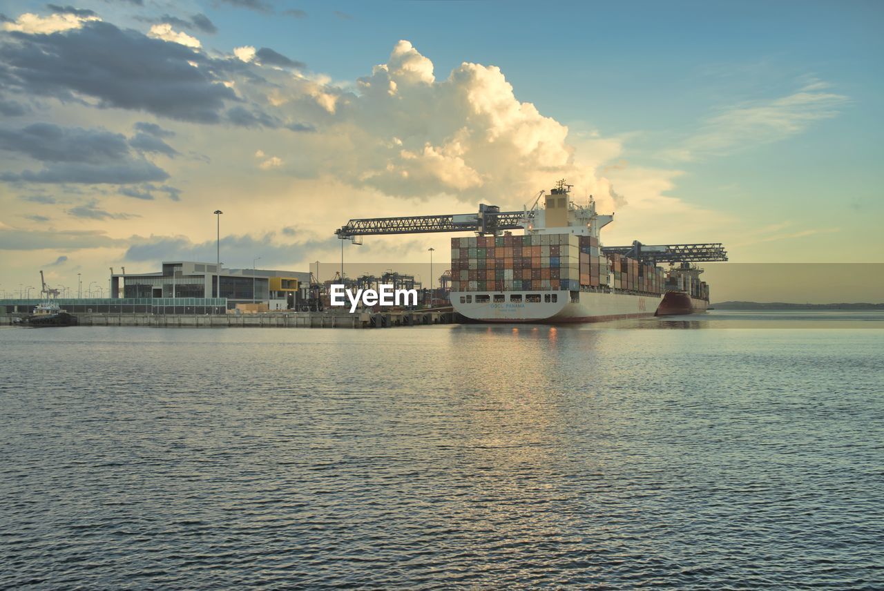 Cargo ship with a scenic view of sea against sky