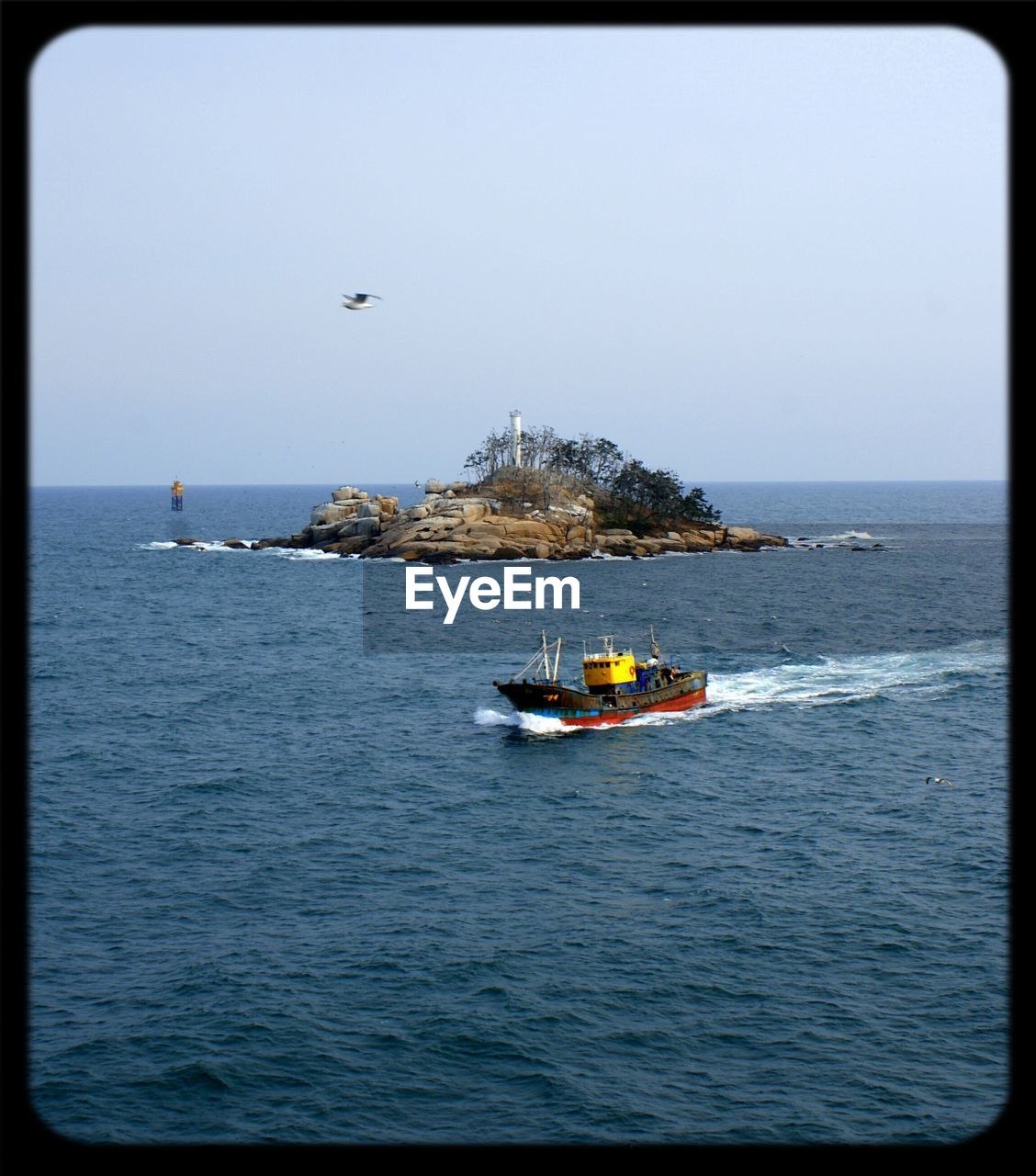 High angle view of ship sailing in sea against clear sky