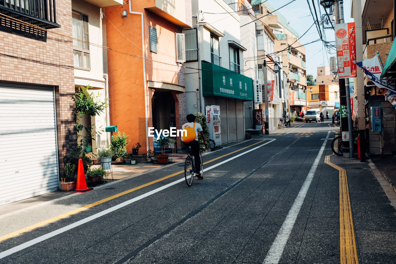 MAN CYCLING ON ROAD