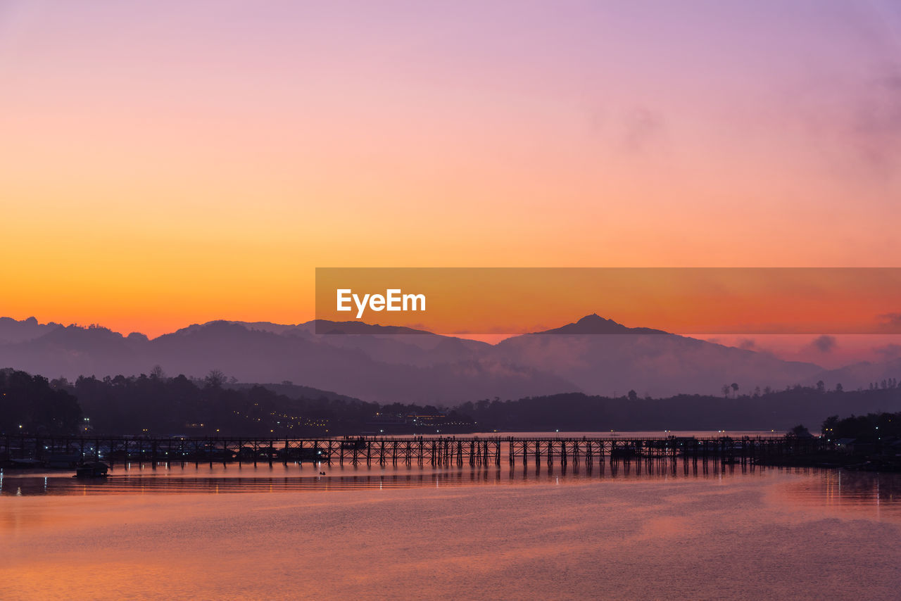 SCENIC VIEW OF LAKE AGAINST ROMANTIC SKY