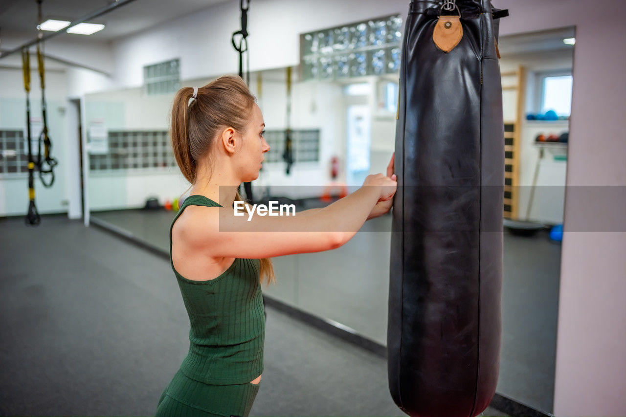 midsection of woman exercising in gym