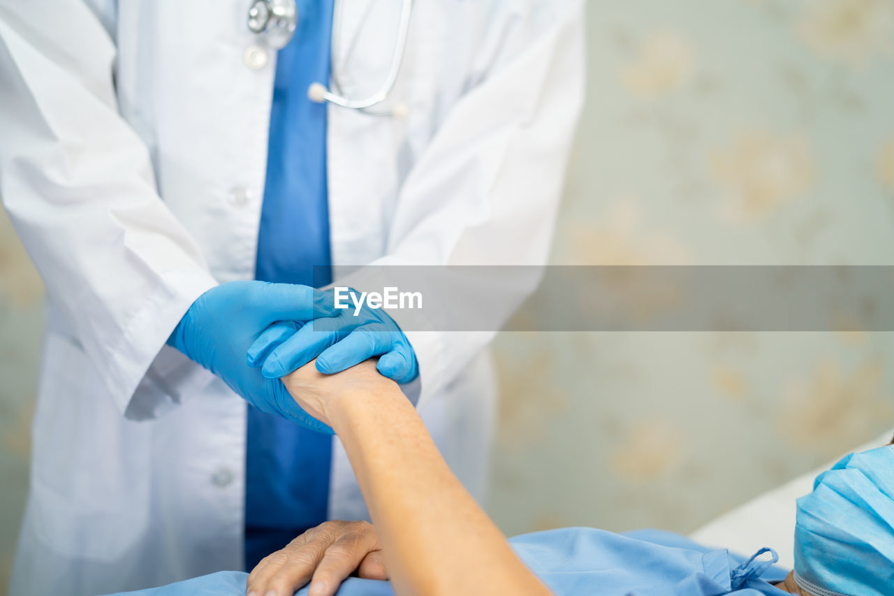 Asian doctor wearing ppe suit new normal to check patient  protect safety infection coronavirus 