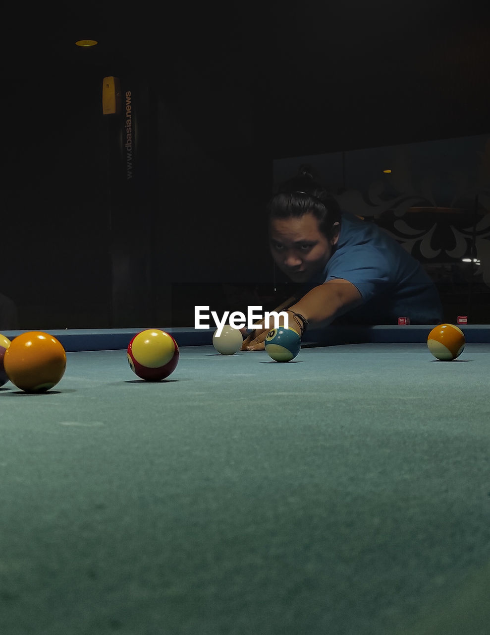 Man playing with ball on table