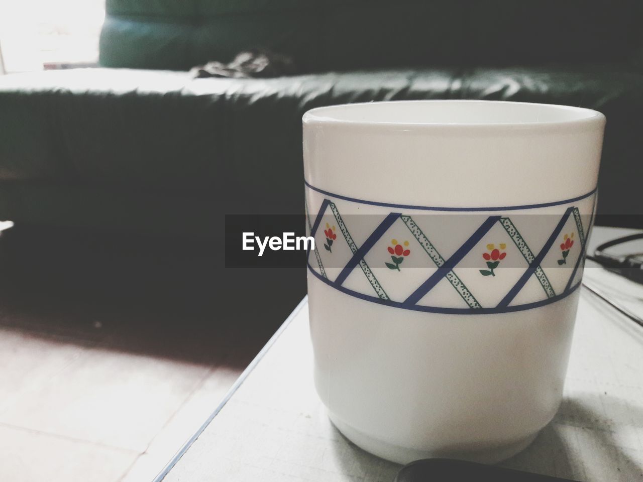 Close-up of coffee cup on table