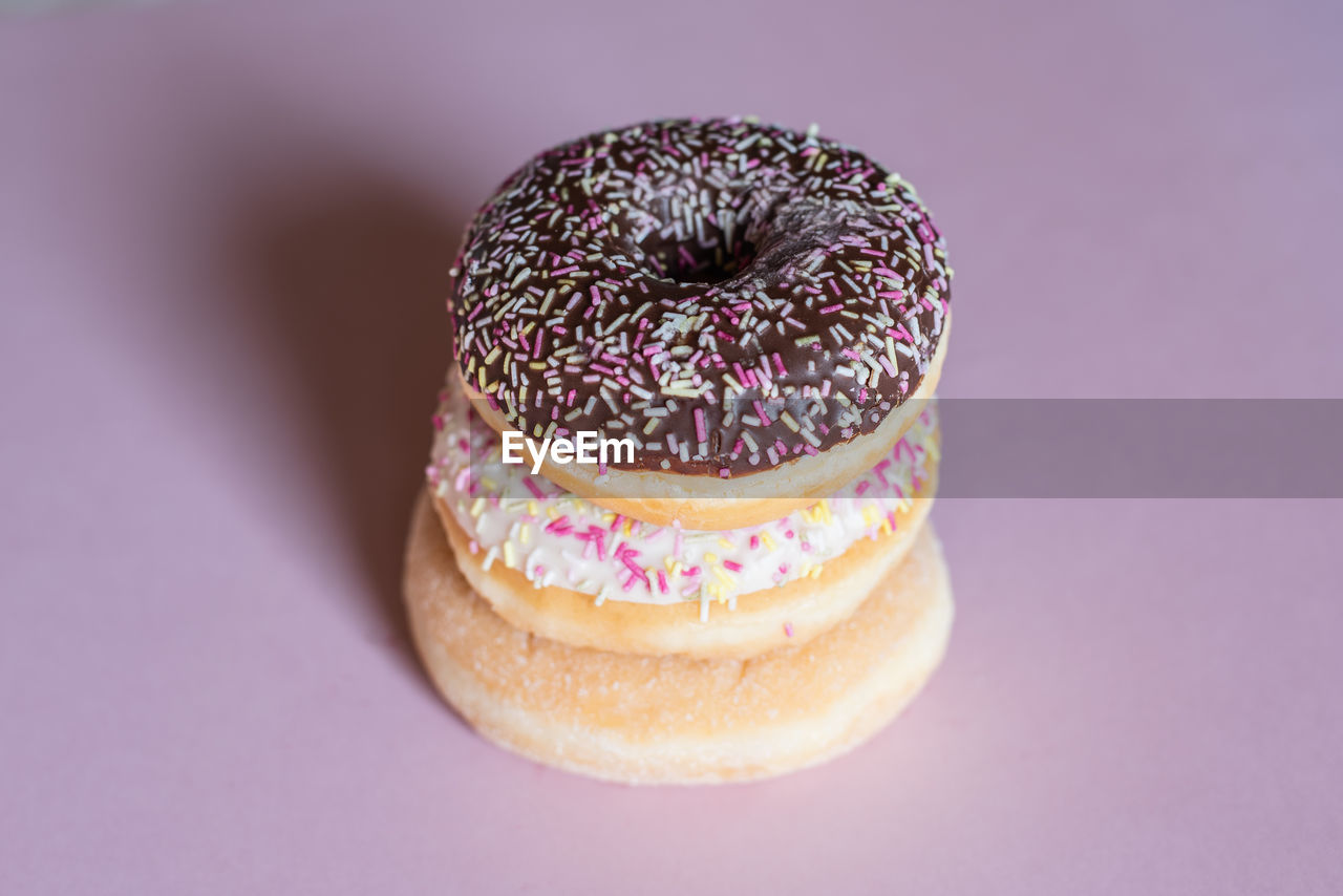 Stack of donuts on table