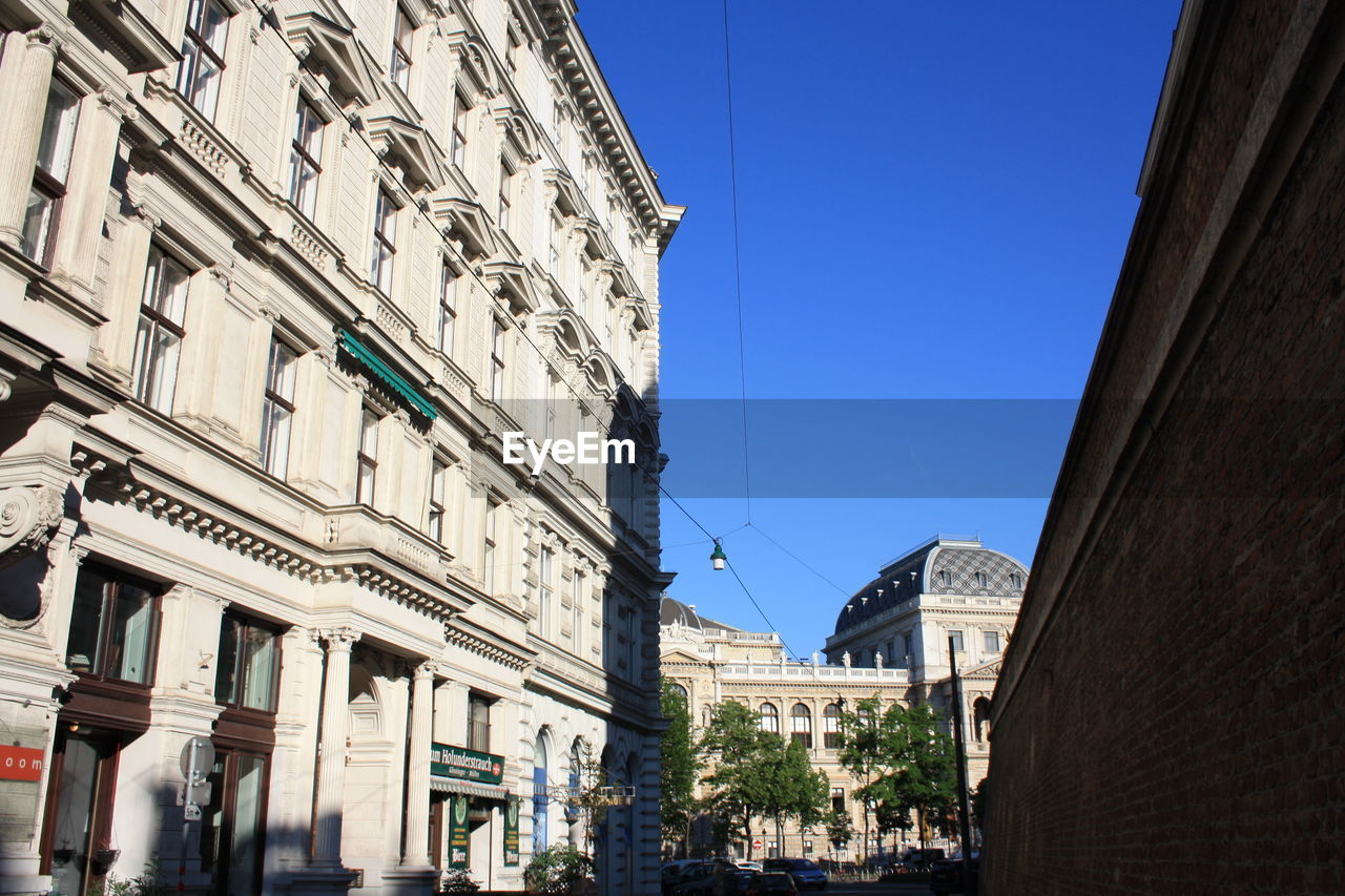 Low angle view of buildings against clear sky