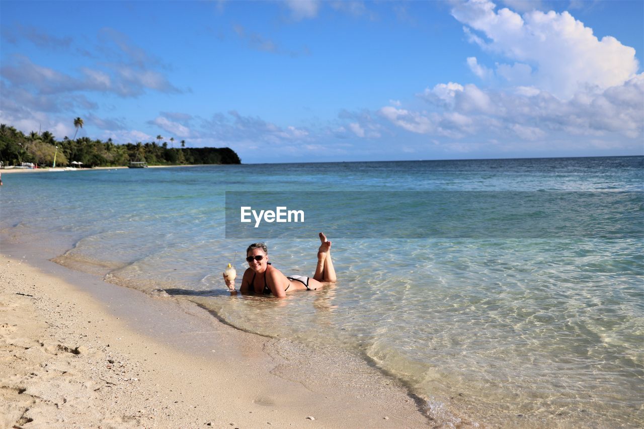 FULL LENGTH OF MAN ON BEACH