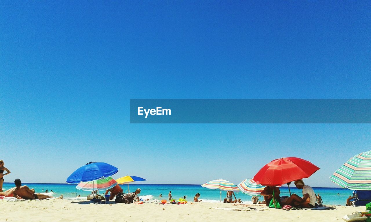 People on sunny beach in spain