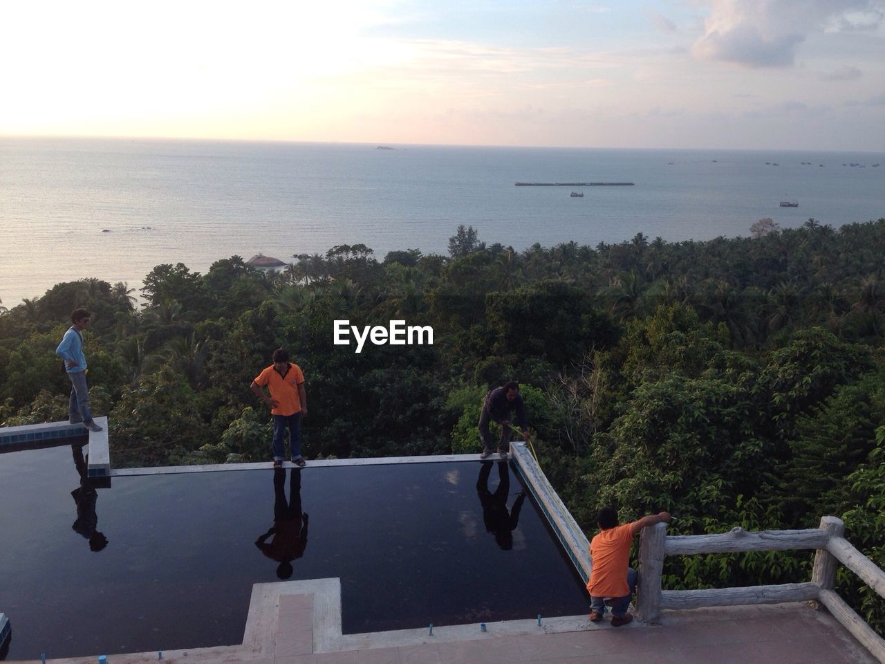 SCENIC VIEW OF SEA WITH TREES IN BACKGROUND