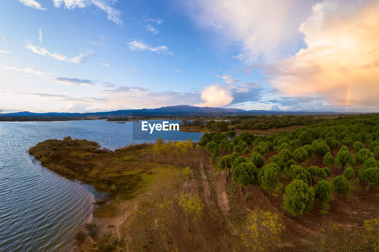 Lake drone aerial view of mountain panorama landscape at sunset in marateca dam in castelo branco