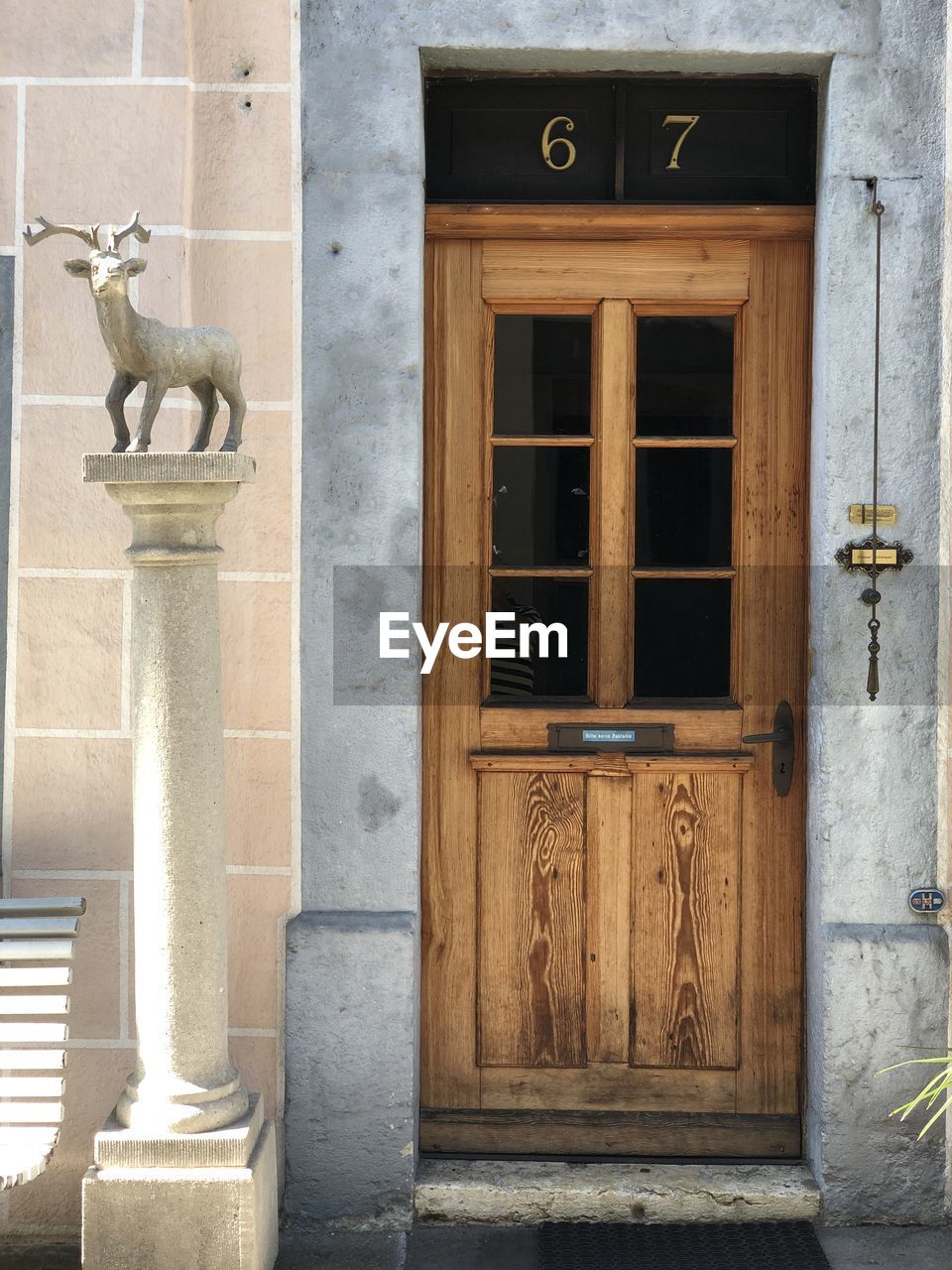 STATUE ON OLD BUILDING