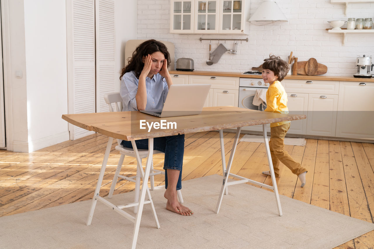 People sitting on table at home