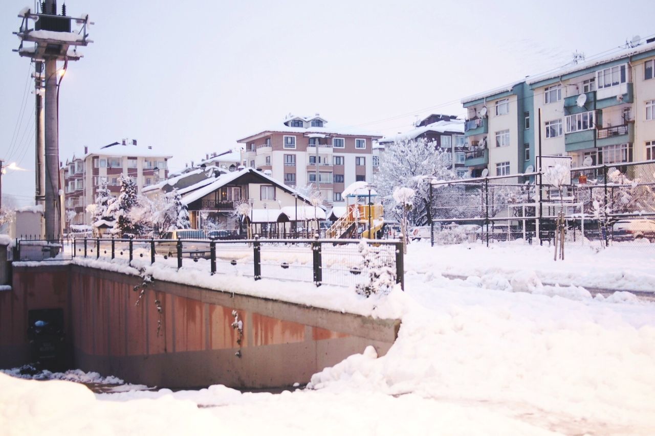 VIEW OF SNOW COVERED HOUSES