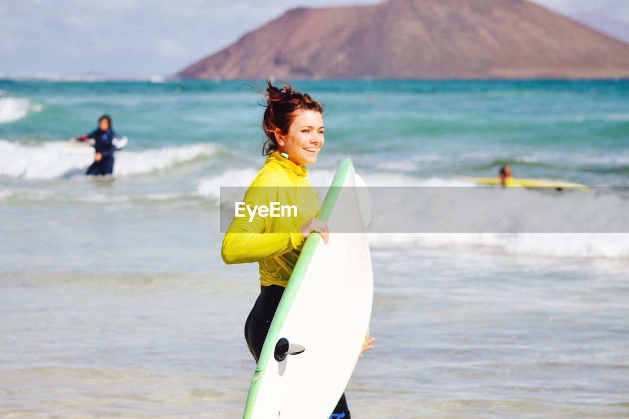 Portrait of a smiling young woman at beach