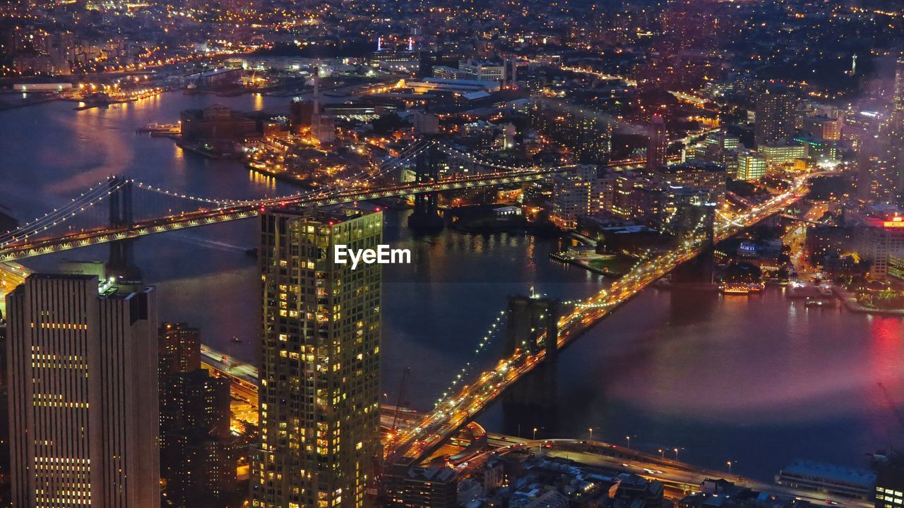 Aerial view of illuminated city at night