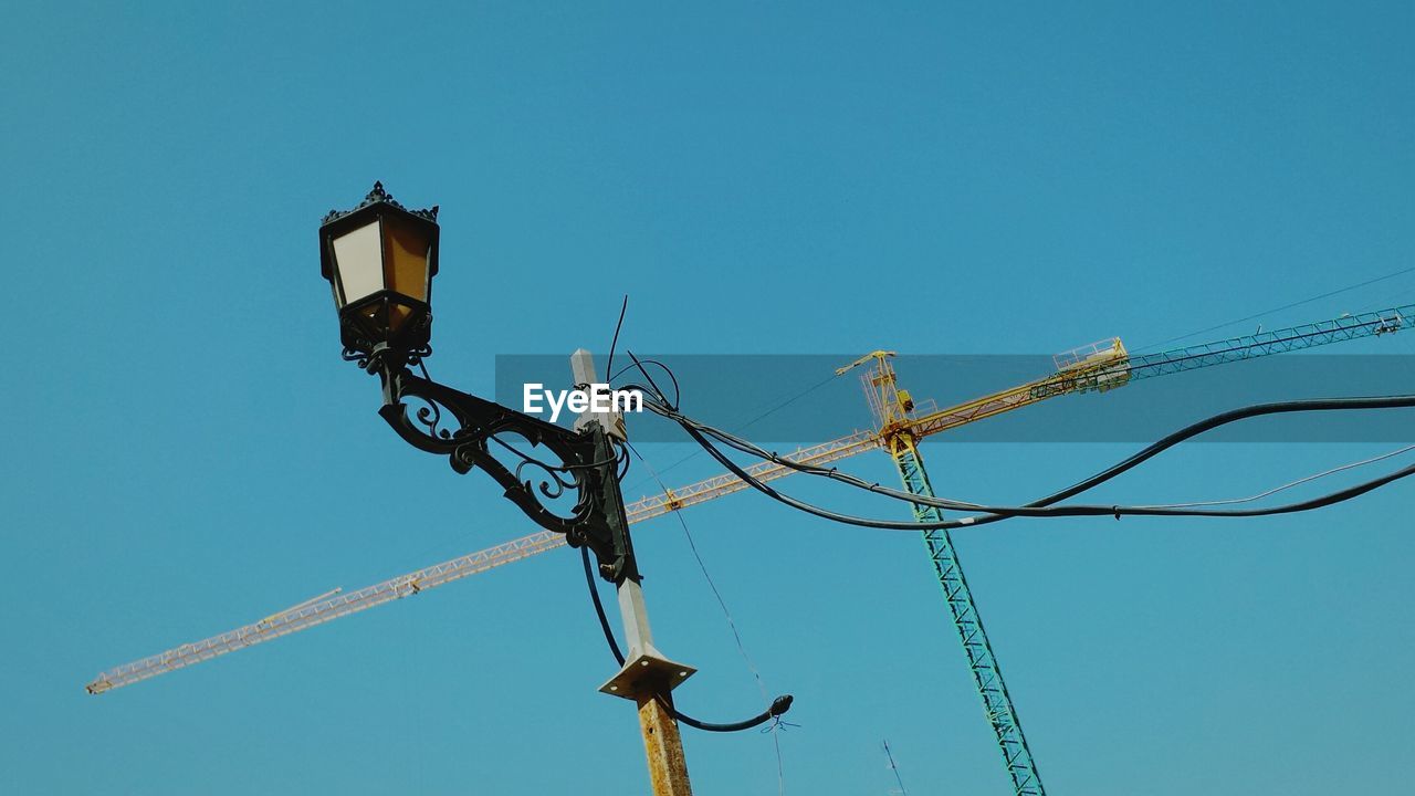 High section of lamp post against clear sky