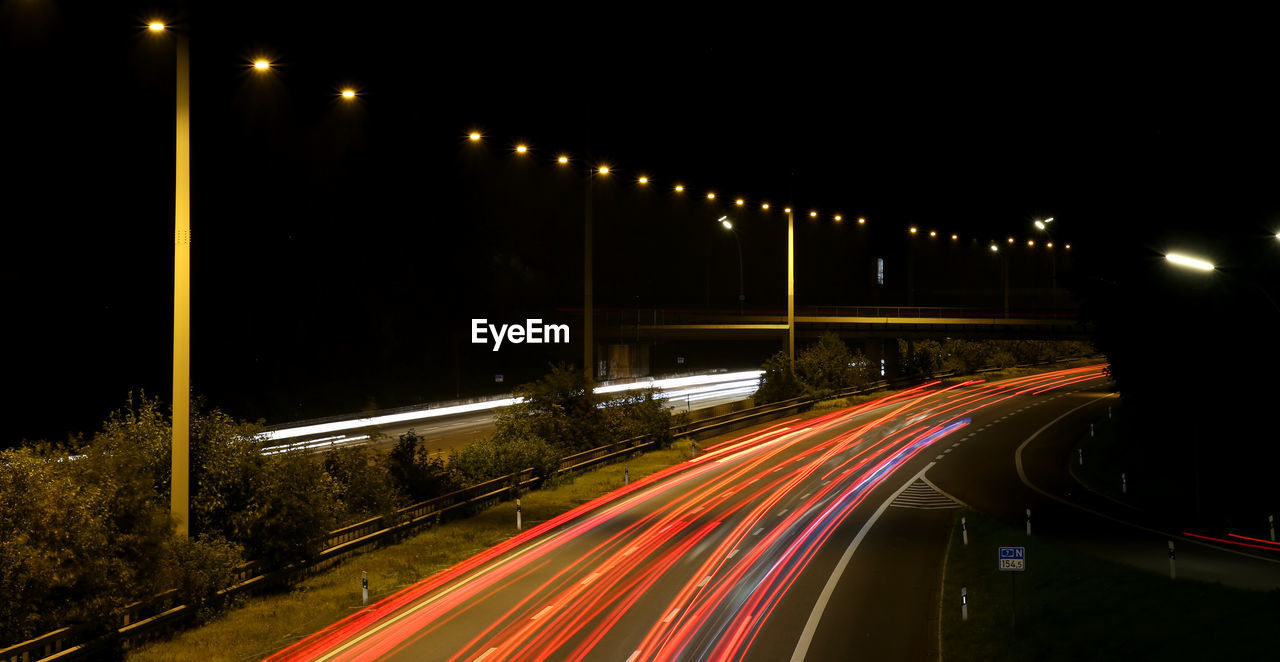 Light trails on road at night