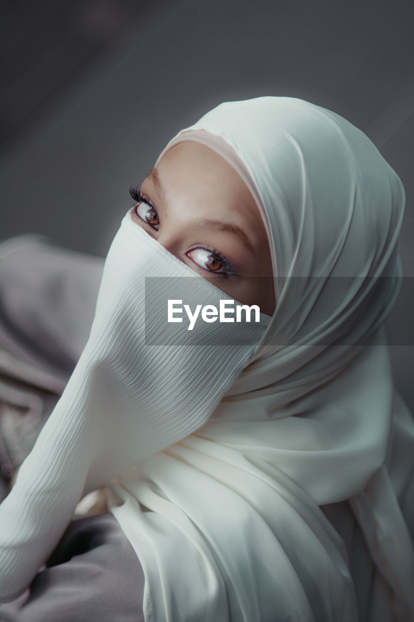 portrait, hijab, female, one person, adult, headscarf, women, veil, white, young adult, indoors, clothing, close-up, looking at camera, person, religion, headshot, human face, looking