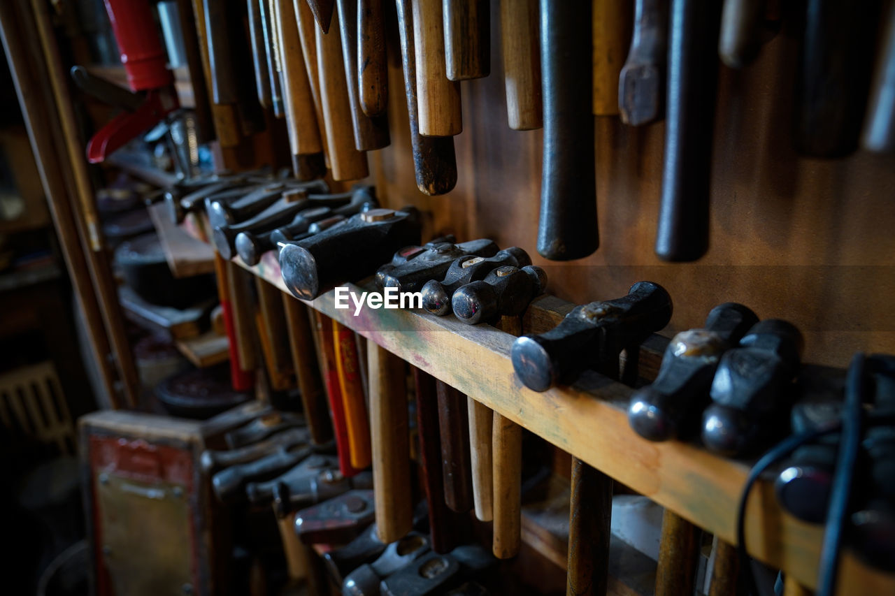 Close-up of shelves with hammers